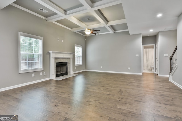 70 Pacific Ave, Sharpsburg, GA 30277 - unfurnished living room with a ceiling fan, plenty of natural light, beam ceiling, baseboards, and coffered ceiling