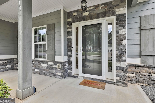 70 Pacific Ave, Sharpsburg, GA 30277 - property entrance featuring stone siding and a porch