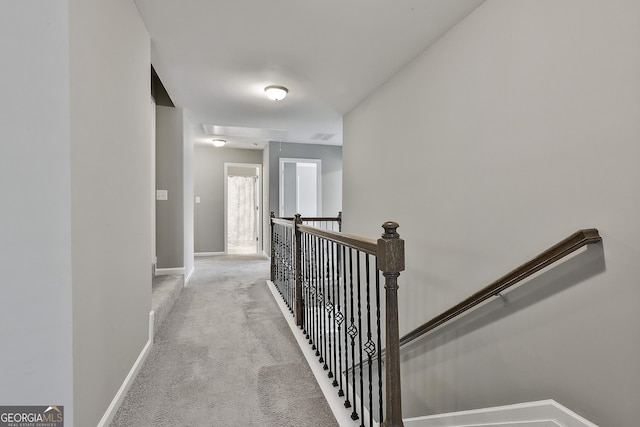 70 Pacific Ave, Sharpsburg, GA 30277 - hallway with carpet flooring, baseboards, attic access, and an upstairs landing