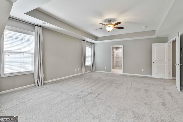 70 Pacific Ave, Sharpsburg, GA 30277 - unfurnished bedroom with a raised ceiling, baseboards, and carpet floors