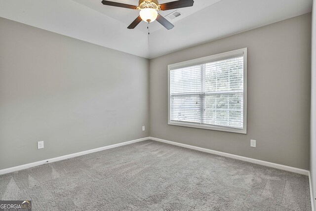 70 Pacific Ave, Sharpsburg, GA 30277 - spare room featuring a ceiling fan, carpet, and baseboards