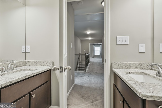 70 Pacific Ave, Sharpsburg, GA 30277 - bathroom featuring two vanities and baseboards