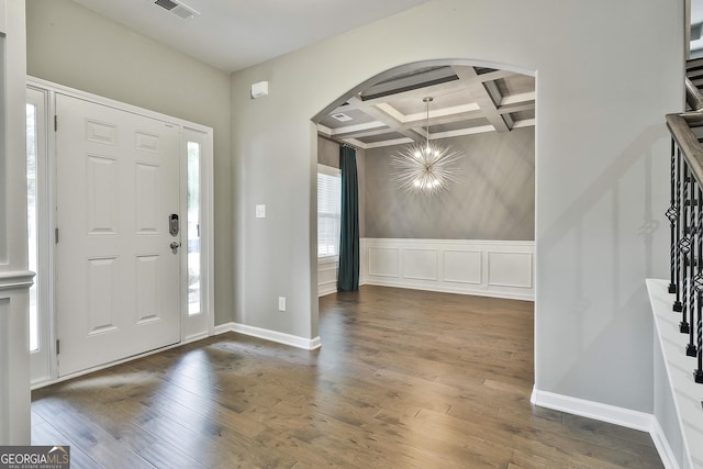 70 Pacific Ave, Sharpsburg, GA 30277 - entryway featuring coffered ceiling, arched walkways, wood-type flooring, beamed ceiling, and stairs