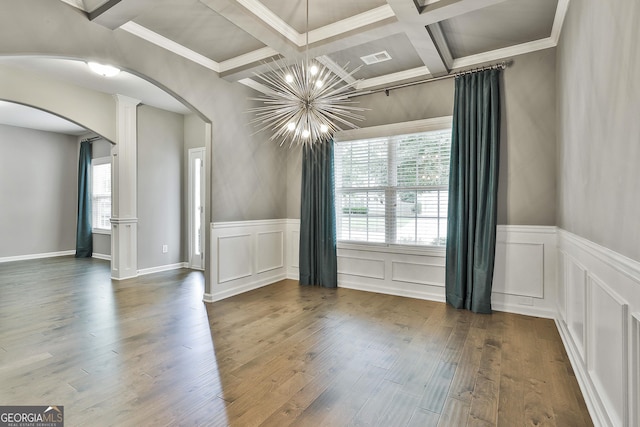 70 Pacific Ave, Sharpsburg, GA 30277 - unfurnished room with arched walkways, coffered ceiling, a chandelier, beamed ceiling, and wood finished floors