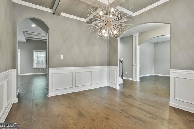 70 Pacific Ave, Sharpsburg, GA 30277 - spare room featuring arched walkways, dark wood-style flooring, crown molding, coffered ceiling, and a wainscoted wall