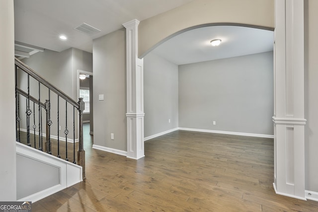 70 Pacific Ave, Sharpsburg, GA 30277 - empty room featuring arched walkways, ornate columns, hardwood / wood-style floors, baseboards, and recessed lighting