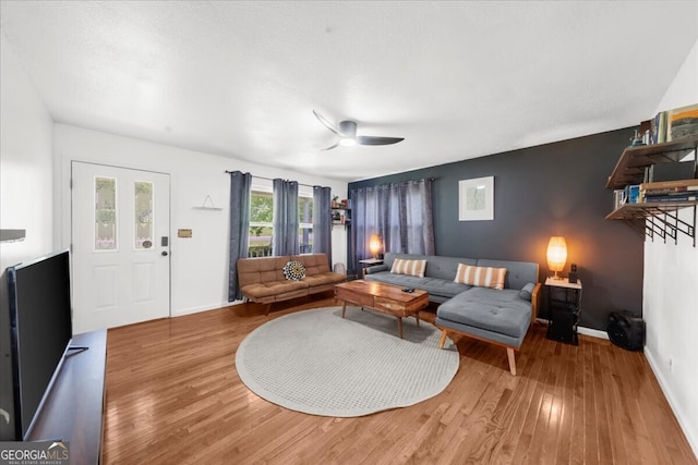 142 Poplar St SW, Calhoun, GA 30701 - living area with baseboards, a ceiling fan, and wood finished floors