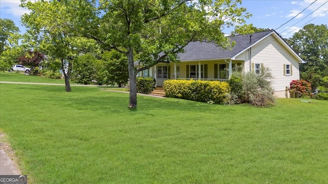 142 Poplar St SW, Calhoun, GA 30701 - view of property exterior featuring a lawn, a shingled roof, and covered porch