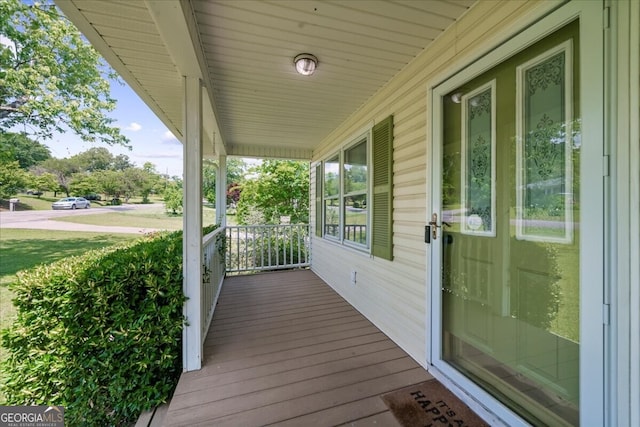 142 Poplar St SW, Calhoun, GA 30701 - wooden deck with a porch