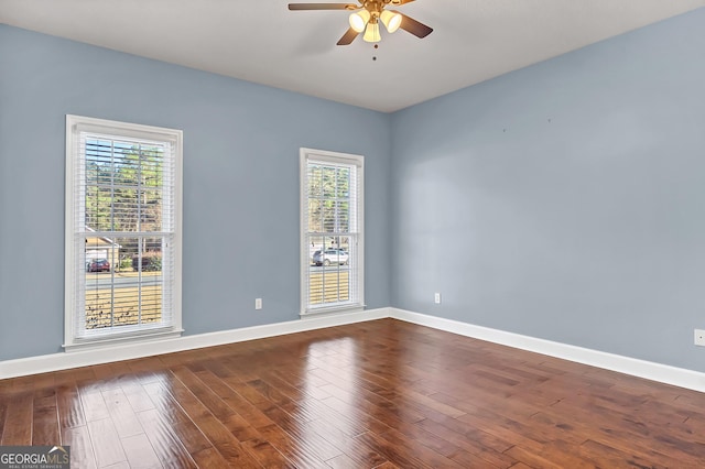 176 Fairethorne Dr, Leesburg, GA 31763 - empty room featuring dark wood finished floors, plenty of natural light, baseboards, and ceiling fan