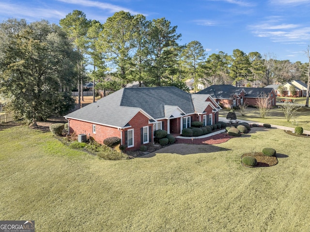 176 Fairethorne Dr, Leesburg, GA 31763 - back of house featuring a yard, central air condition unit, brick siding, and a shingled roof