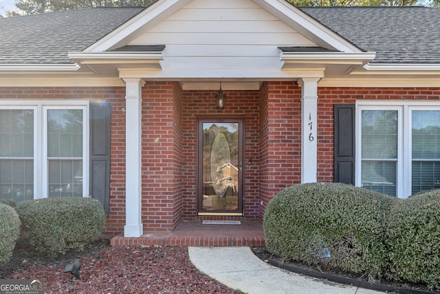 176 Fairethorne Dr, Leesburg, GA 31763 - property entrance with a shingled roof and brick siding