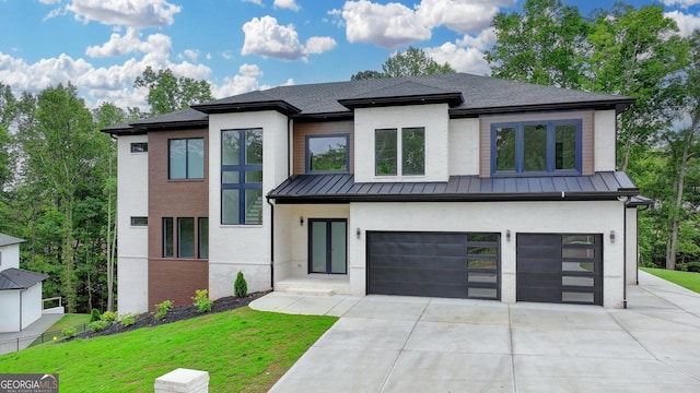 view of front of property with an attached garage, brick siding, driveway, metal roof, and a standing seam roof
