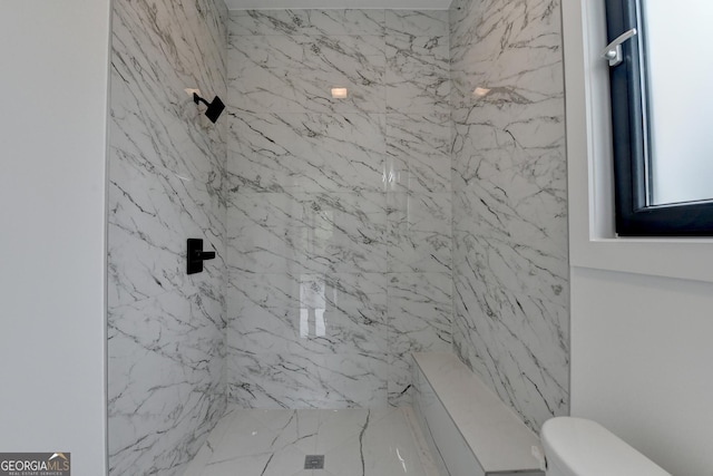 full bathroom with toilet and a marble finish shower