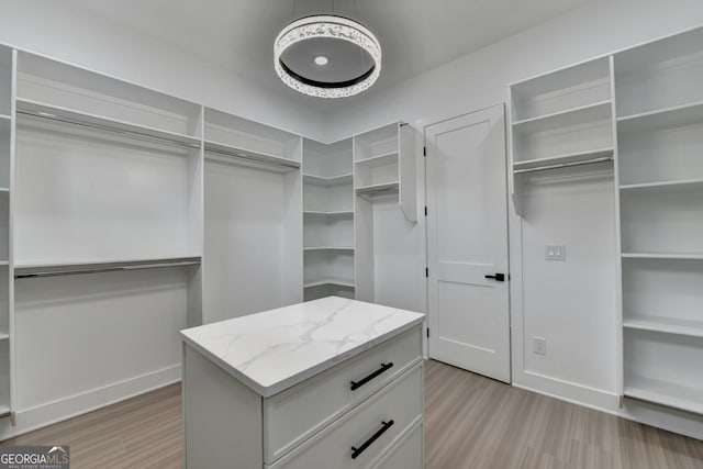 spacious closet featuring light wood-type flooring