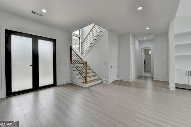 foyer entrance featuring baseboards, stairs, recessed lighting, and visible vents