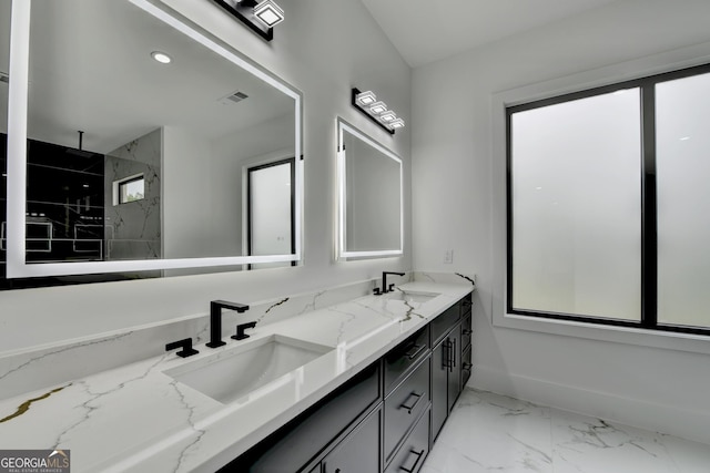 bathroom featuring a marble finish shower, a sink, visible vents, baseboards, and marble finish floor