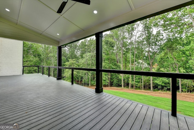 deck with a lawn and ceiling fan