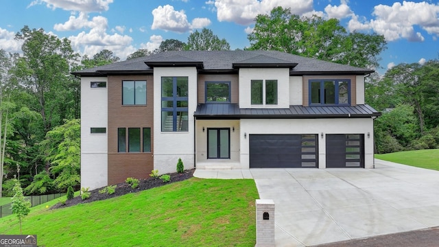 contemporary house with an attached garage, fence, a front lawn, driveway, and a standing seam roof