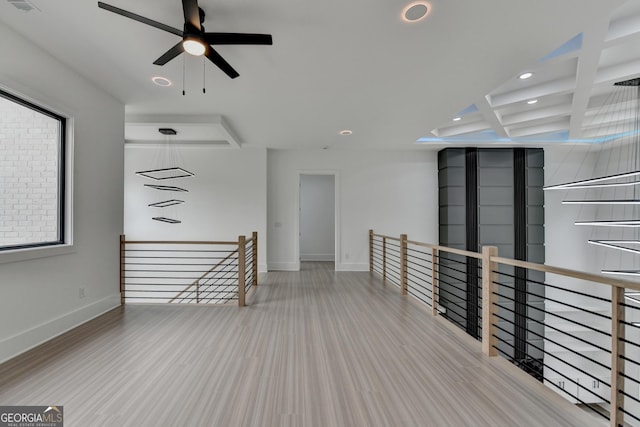 interior space with recessed lighting, coffered ceiling, baseboards, ceiling fan, and beamed ceiling