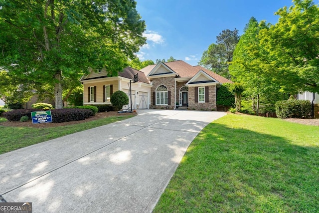 view of front of house featuring concrete driveway, a front yard, an attached garage, and stone siding