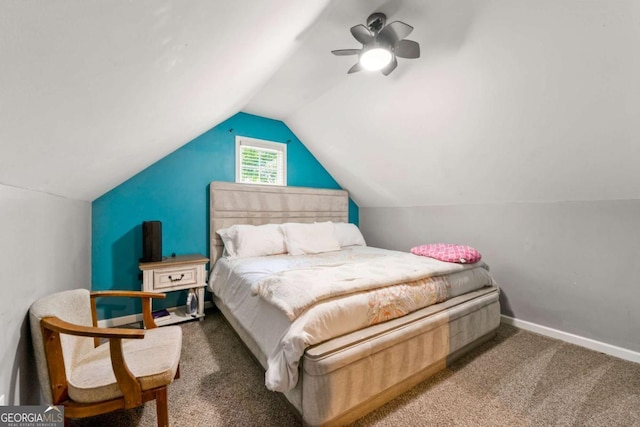 bedroom featuring vaulted ceiling, carpet, baseboards, and a ceiling fan