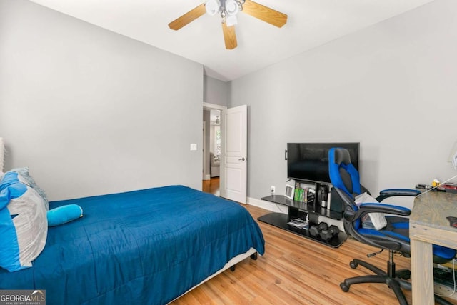 bedroom featuring ceiling fan and wood finished floors