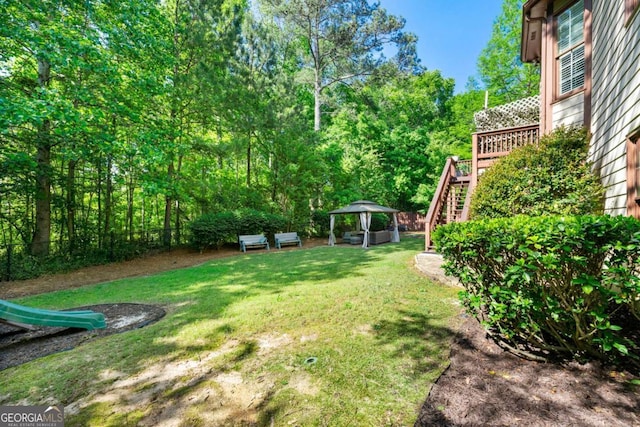 view of yard with stairway and a gazebo