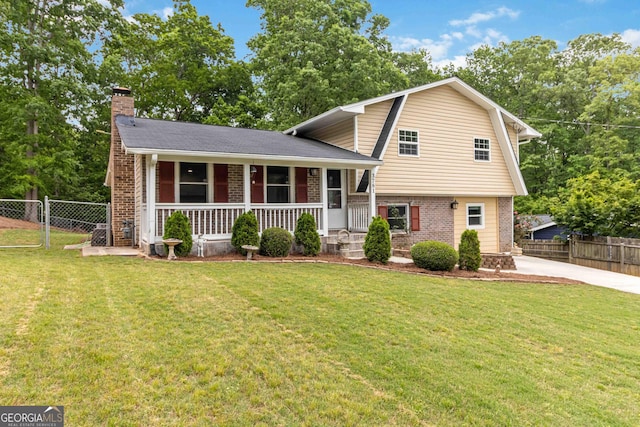 3781 Cherokee Trl, Suwanee, GA 30024 - tri-level home with brick siding, a porch, a chimney, driveway, and a gambrel roof