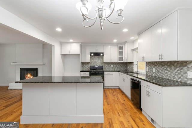 3781 Cherokee Trl, Suwanee, GA 30024 - kitchen with black appliances, a chandelier, tasteful backsplash, white cabinetry, and recessed lighting