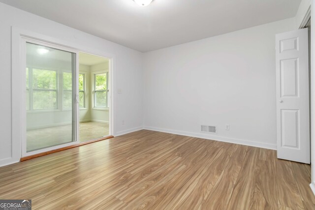 3781 Cherokee Trl, Suwanee, GA 30024 - empty room featuring light wood-style floors and baseboards