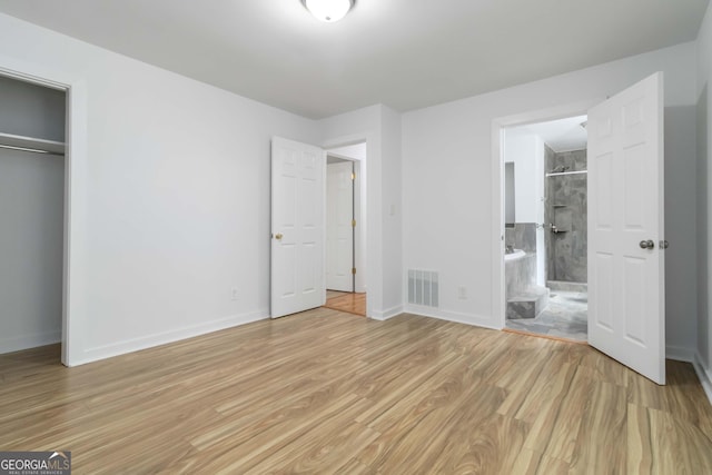 3781 Cherokee Trl, Suwanee, GA 30024 - unfurnished bedroom with light wood-style floors, a closet, and ensuite bathroom