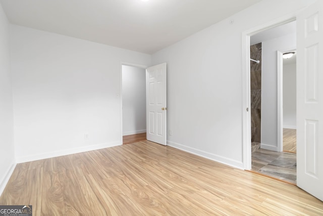 3781 Cherokee Trl, Suwanee, GA 30024 - unfurnished bedroom featuring light wood-style flooring and baseboards