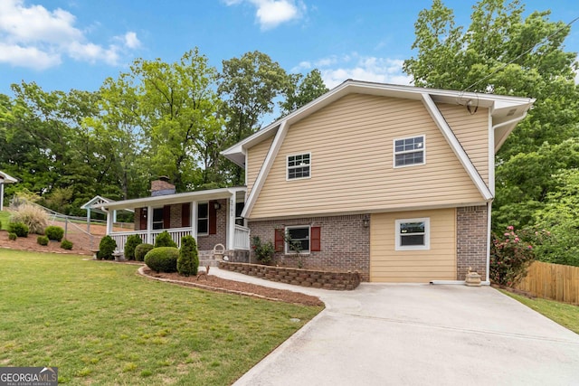 3781 Cherokee Trl, Suwanee, GA 30024 - view of front of property featuring brick siding, covered porch, driveway, and a chimney