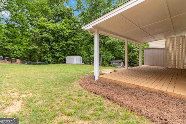 3781 Cherokee Trl, Suwanee, GA 30024 - view of yard with a storage shed and a deck