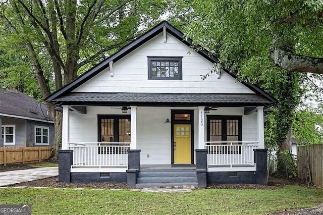 1120 Arlington Ave SW, Atlanta, GA 30310 - bungalow-style house featuring a front lawn, a porch, roof with shingles, and fence