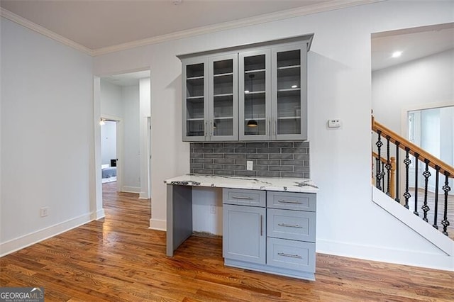 1120 Arlington Ave SW, Atlanta, GA 30310 - kitchen with tasteful backsplash, wood finished floors, glass insert cabinets, gray cabinetry, and baseboards
