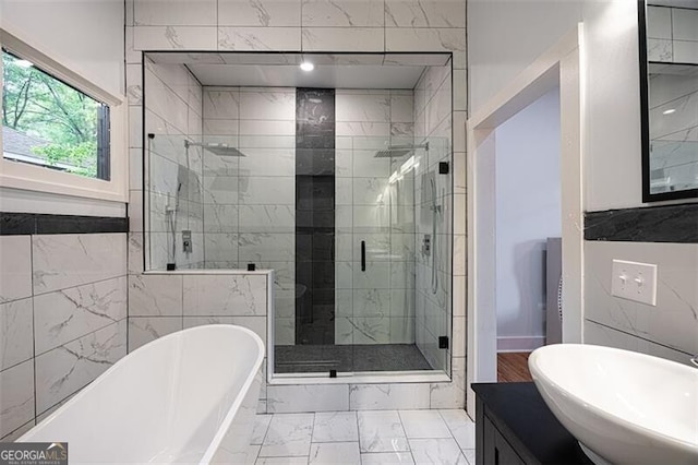 1120 Arlington Ave SW, Atlanta, GA 30310 - bathroom with vanity, a shower stall, marble finish floor, and a freestanding tub