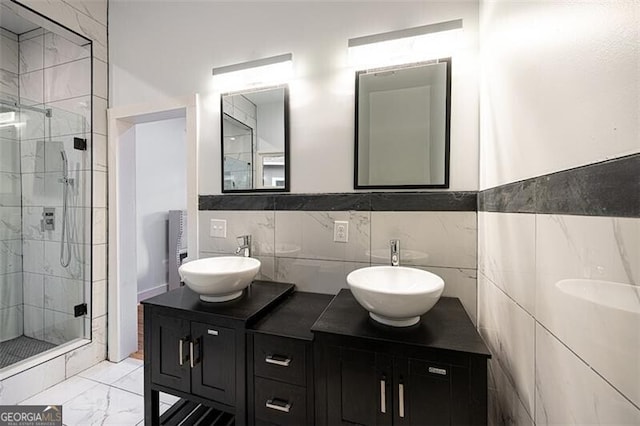 1120 Arlington Ave SW, Atlanta, GA 30310 - bathroom with double vanity, tile walls, a stall shower, and a sink