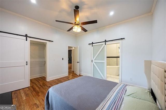 1120 Arlington Ave SW, Atlanta, GA 30310 - bedroom with baseboards, crown molding, a barn door, and wood finished floors