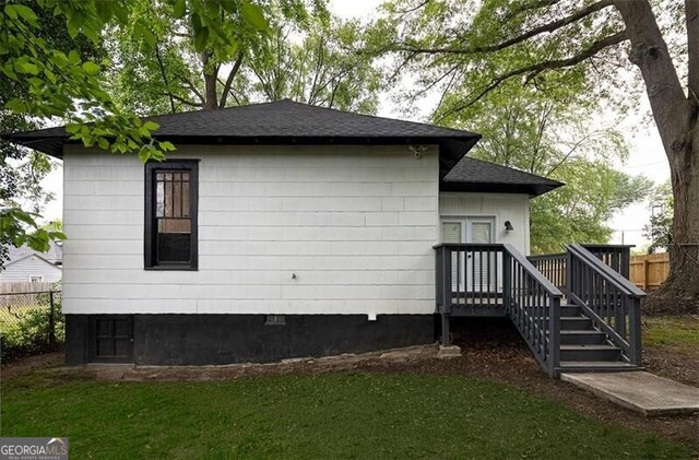 1120 Arlington Ave SW, Atlanta, GA 30310 - view of side of home with a lawn, roof with shingles, and fence