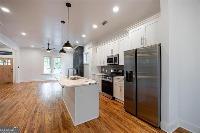 1120 Arlington Ave SW, Atlanta, GA 30310 - kitchen featuring a ceiling fan, a sink, stainless steel appliances, white cabinetry, and visible vents