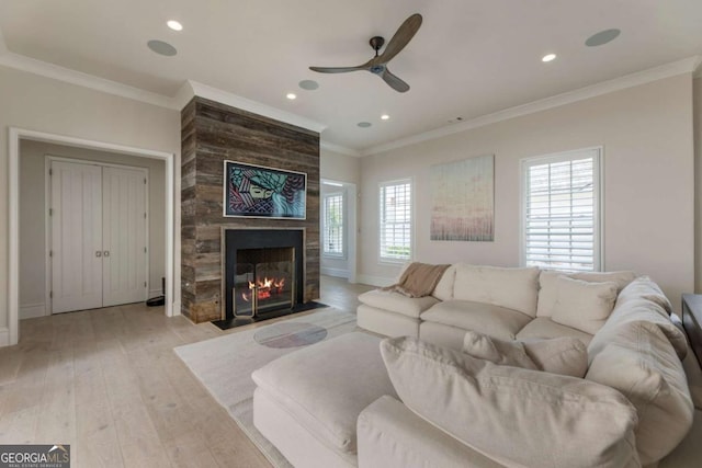 316 S Esplanade, Alpharetta, GA 30009 - living area featuring light wood-type flooring, recessed lighting, a large fireplace, crown molding, and ceiling fan