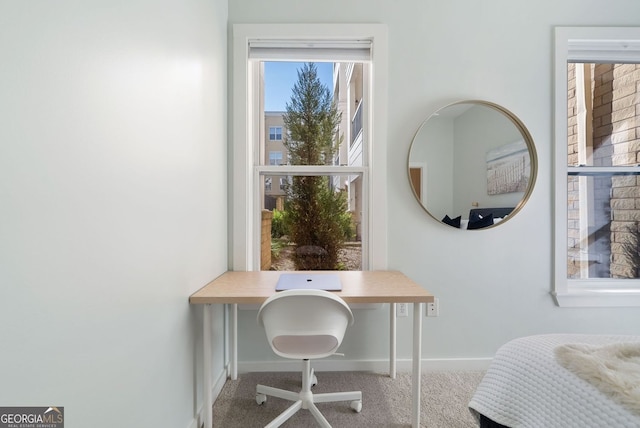 bedroom with baseboards and carpet floors