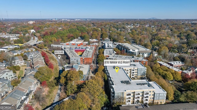 birds eye view of property featuring a wooded view