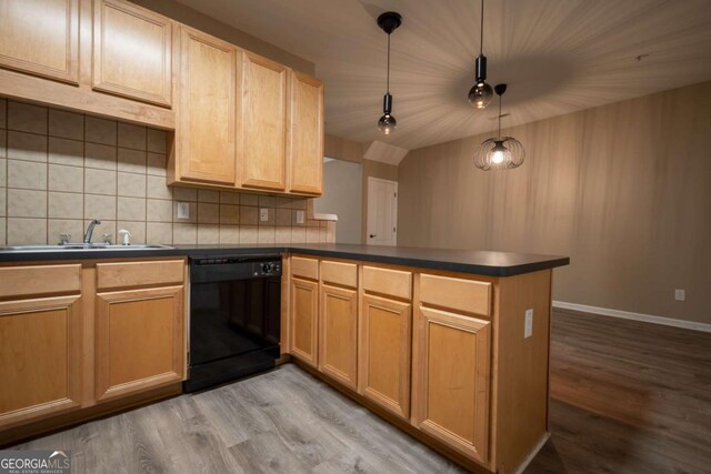 96 Portico Pl, Newnan, GA 30265 - kitchen with black dishwasher, a peninsula, a sink, and wood finished floors