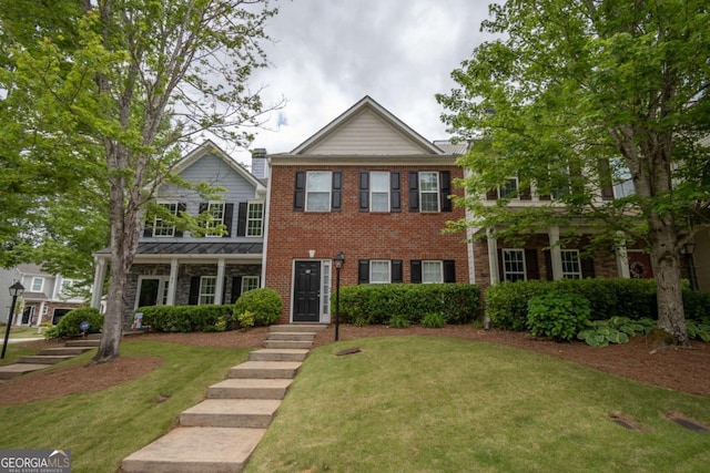 96 Portico Pl, Newnan, GA 30265 - view of front of house with a front yard and brick siding