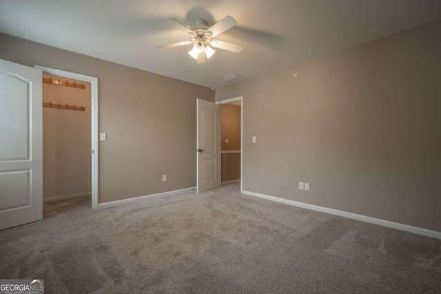 96 Portico Pl, Newnan, GA 30265 - unfurnished bedroom featuring ceiling fan, carpet flooring, and baseboards
