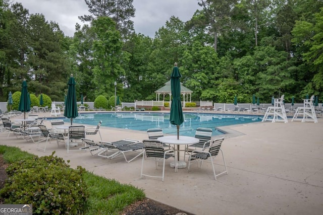 96 Portico Pl, Newnan, GA 30265 - community pool with a patio and fence