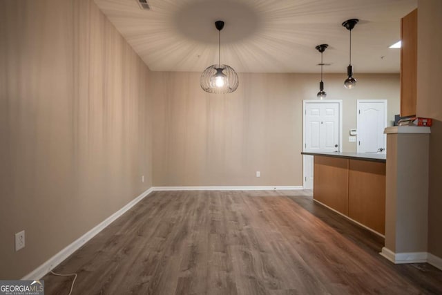 96 Portico Pl, Newnan, GA 30265 - unfurnished dining area featuring dark wood finished floors and baseboards